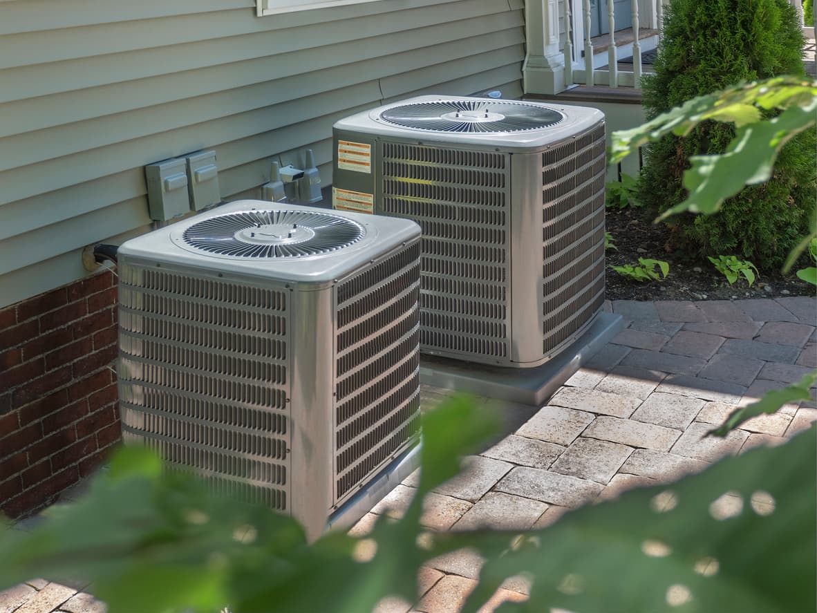 Outdoor air conditioning units beside an Oklahoma home served by Air Factory